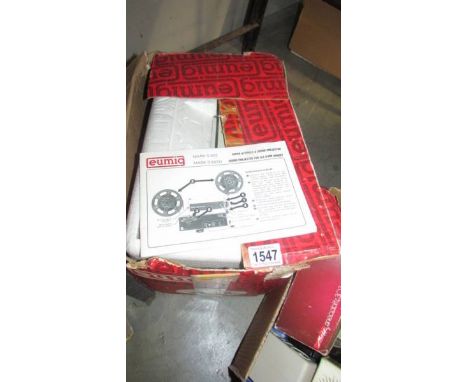 A Eumig Super 8 sound projector with instructions.