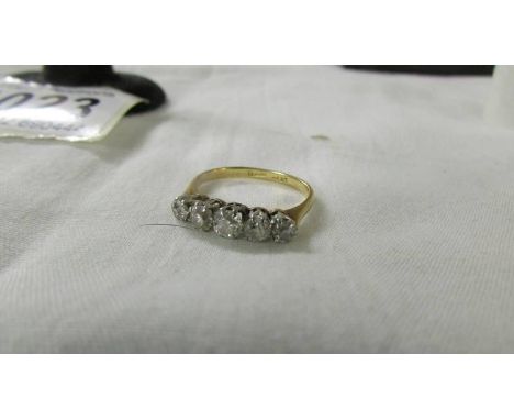 A five stone gold and platinum diamond ring, size K, 2.8 grams.*Condition report*14ct gold. Good clarity of diamonds. No chip