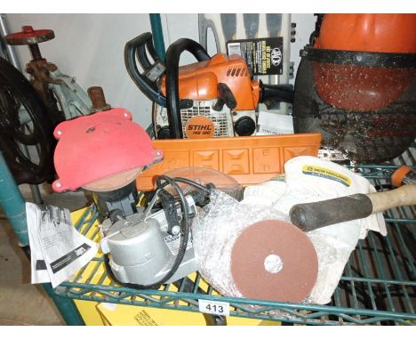 A chainsaw, sharpener, protective head gear, box of chisels &amp; level etc. COLLECT ONLY