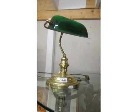 A good quality brass bankers lamp with green glass shade. COLLECT ONLY.