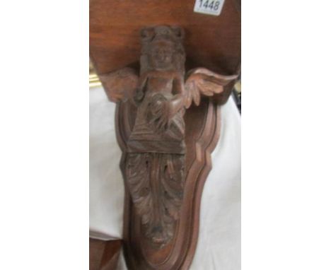 A carved oak wall bracket carved with an angel. COLLECT ONLY.