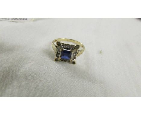 A square sapphire and diamond ring in yellow gold, size N half.*CONDITION REPORT*4.5mm x 4.5mm x 1.25mm approximately.1 diamo