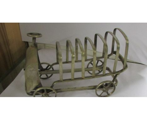 A rare art deco silver plated toast rack in the form of a lorry.