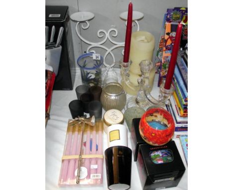 A selection of candle holders and candles, including candelabra, tea light stand etc