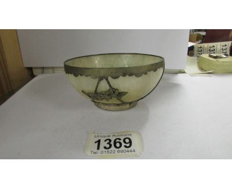 A Tibetan silver mounted jade tea bowl, impressed mark to base, 11 cm diameter, 5 cm high.