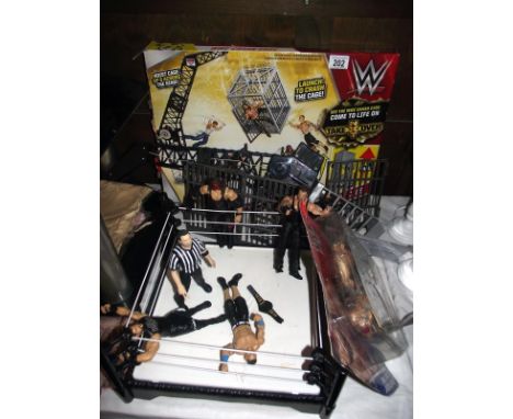 WWE wrestling ring and figures, box is a/f and completeness unknown, includes a pack of other wrestlers
