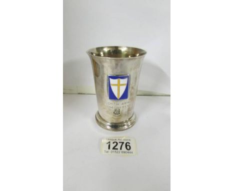 A silver tumbler with Eighth army 1941-1945 emblem.