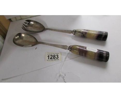 A pair of antique silver plate salad/vegetable servers with blue John stone handles.*CONDITION REPORT*Handle on fork has a gl