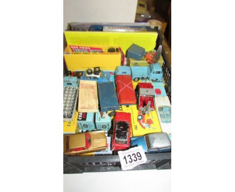 A selection of playworn Corgi toys in original paint, in reproduction boxes.