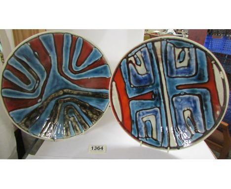 Two Poole pottery plates, 27 cm diameter.