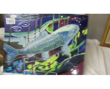 A ceramic wall plaque decorated with pike. 35 x 28 cm,