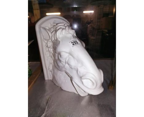 A large white glazed pottery horses head wall bracket, top 16cm x 28.5cm, height 26cm