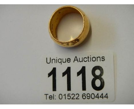 A wide 22ct gold wedding ring, size K. 14 grams.