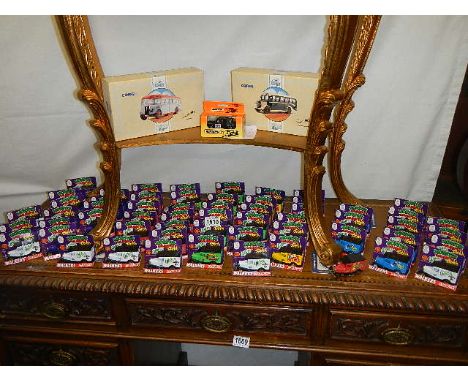 Boxed Corgi classics 81549 and 81550 coaches and a large quantity of Oxford die cast Walkers Monster Munch model vans.