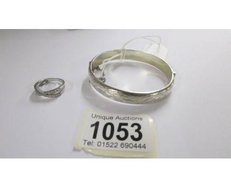A silver bangle and a silver ring, 16 grams.