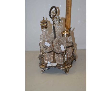 Silver plated cruet stand with bottles