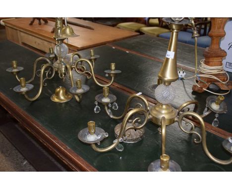 A pair of modern six branch ceiling light fittings