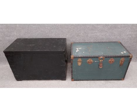 A heavy painted trunk, reinforced with iron strap-work with cast iron handles, along with an early 20th century steamer trunk