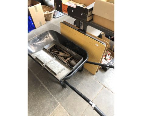 A wheel barrow and a metal toolbox and contents 