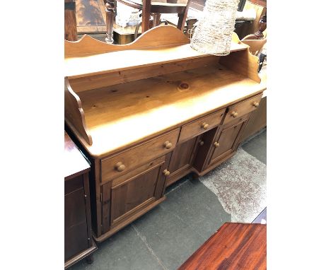 A pine sideboard with shelf back. 