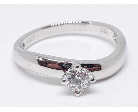 A silver solitaire ring, marked '925 DQCZ', size V, with box. 