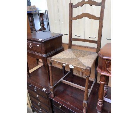 A rush seated ladder back chair. 