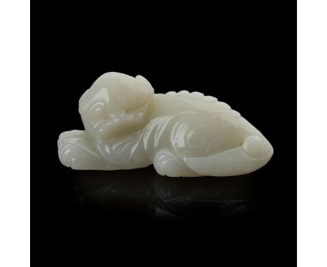  [PRIVATE ENGLISH COLLECTION, ENGLAND] CHINESE WHITE JADE CARVING OF A SEATED LION-DOG 19TH-20TH CENTURY 十九世紀至二十世紀 白玉雕臥獅carve