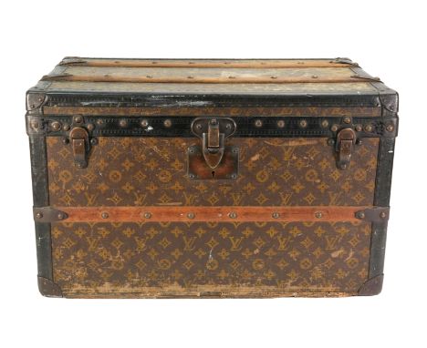 A 1920s Louis Vuitton medium cabin trunk, with LV monogrammed canvas, with timber reinforcement and brass corner supports, th