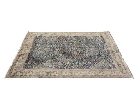 A large Persian blue silk and wool Nain carpet, the central field profusely decorated with deer, rabbit, flowers and trees wi