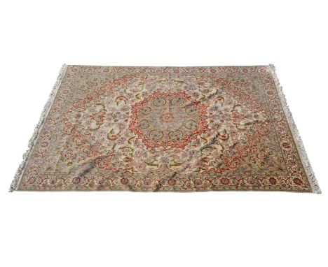 Early 20th century Tabriz silk carpet, has a floral design around a central floral medallion in soft colours adorned with sty
