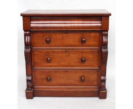 A Victorian mahogany four drawer chest, rectangular top over scrolling frieze drawer, over three long drawers, flanked by fer