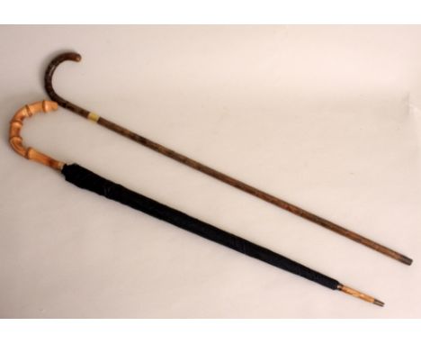 An early 20th century malacca walking stick by Swaine, Adeney & Brigg with silver gilt collar, by Charles Chesterman, London 