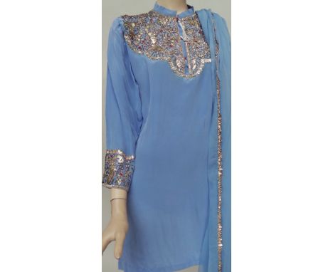 An Indian tunic and traditional trousers with heavy beading to yolk, cuffs and trousers with a matching blue chiffon scarf. A
