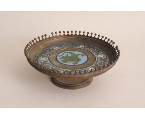 A mid Victorian gilt metal and champleve enamel tarza in the Gothic Revival taste, the circular bowl centred by a wyvern with
