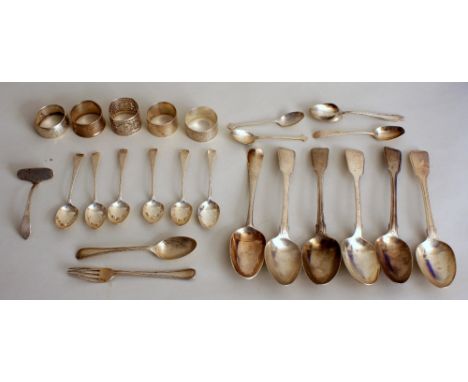 A mixed lot of Georgian and later silver spoons, fork, and napkin rings, including a set of six tea spoons, a set of four Geo