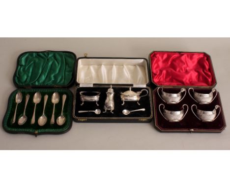 A cased set of four Victorian silver salts, by James Dixon & Sons, Sheffield 1894, with three spoons, a cased set of Elizabet