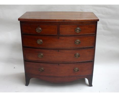 A Georgian mahogany bow fronted chest of drawers, two short drawers over three graduating long drawers, on splayed feet