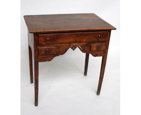A George III oak and elm low boy, the later rectangular top above three drawers on square tapered legs, 76cmW x 50cmD