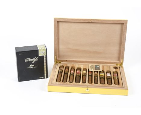 An unopened box of Davidoff cigars with seal intact, together with an oriental box opening to reveal ten more graduated Havan
