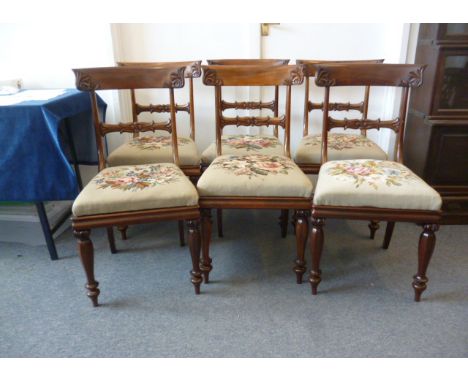 A set of six Rosewood Bar Back dining chairs,  with carved foliate back splats, with tapestry drop in seats, on Heptagonal sh