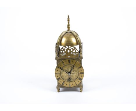 A Victorian 17th Century style brass lantern clock,  the circular dial engraved with motifs and with Roman numerals and pierc