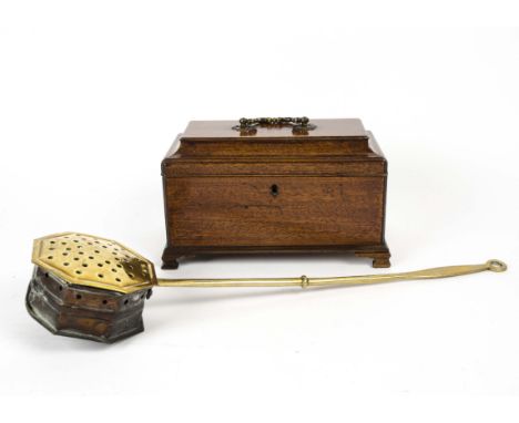 A 20th Century oak tea caddy, on raised feet with a metal handle, height 15cm, together with a brass chestnut pan, length 51 