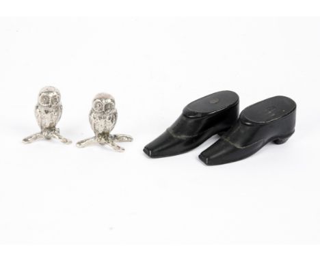 A pair of 19th Century treen snuff box shoes,  together with two silver plated metal owls, length of shoes 8 cm (4) 