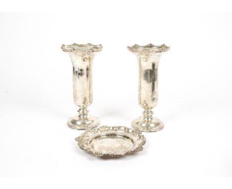 A pair of George V silver Walker & Hall vases, Sheffield 1929, with fluted rims and mounted on circular wooden bases, height 