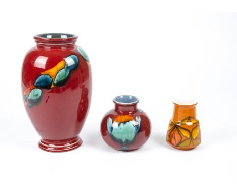 Three pieces of Poole Pottery, two in the volcanic living glaze collection resembling lava over cold stones, the smaller exam