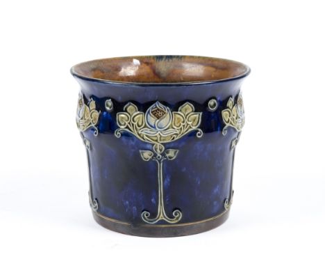 A Royal Doulton Art Nouveau jardinière, the exterior with stylised organic imagery in relief on a blue glazed ground, incised