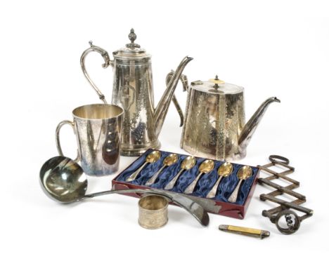 A large quantity of silver plate, including a vanity set, plated hip flask, plated flatware, ladle, teapot with bone finial a