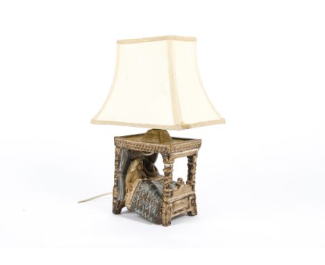 A 1970's Tremaen studio pottery lamp base, designed by Peter Ellery Newlyn Cornwall, modelled as a couple in bed, with a whit
