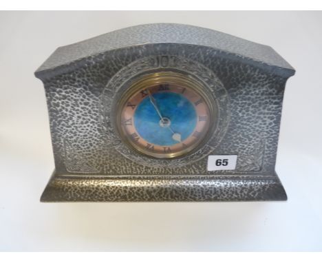 A Liberty & Co Tudric Pewter and enamel mantel clock, model no.01156, hammered finish, cast in low relief with foliate panels