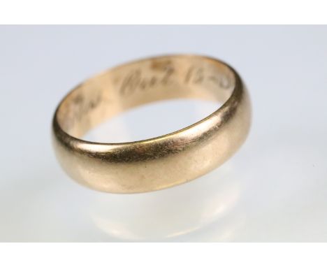 14ct yellow gold wedding band, width approx 5.8mm, interior engraved F X Kovlos Oct 15-1911, ring size Q-Q½ 